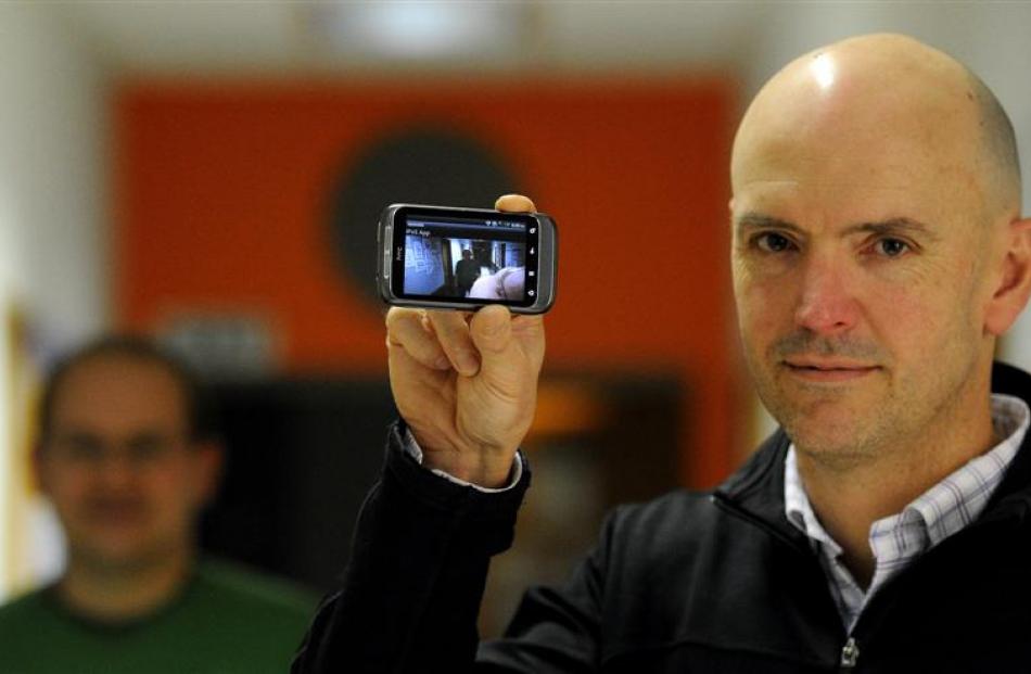 PhD supervisors Prof Brendan McCane (right) and Dr Steven Mills show off an app designed by...
