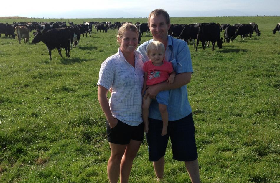 Phillip Colombus checks the cows with his wife Mel and daughter Emily (14 months) on the Eyrewell...