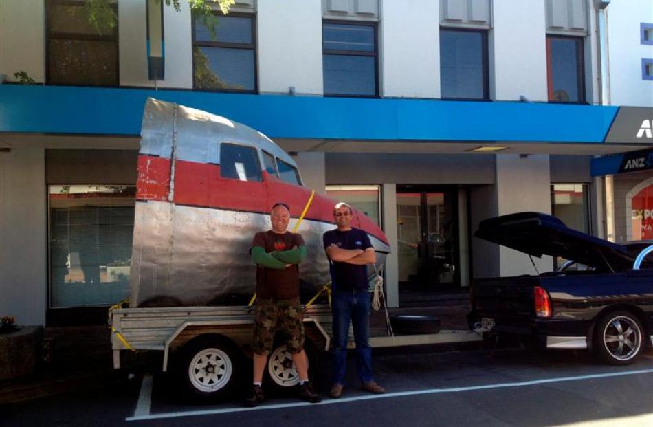 Pilot and aviation enthusiast Athol Murray (left) with his brother Dave and the nose of a former...