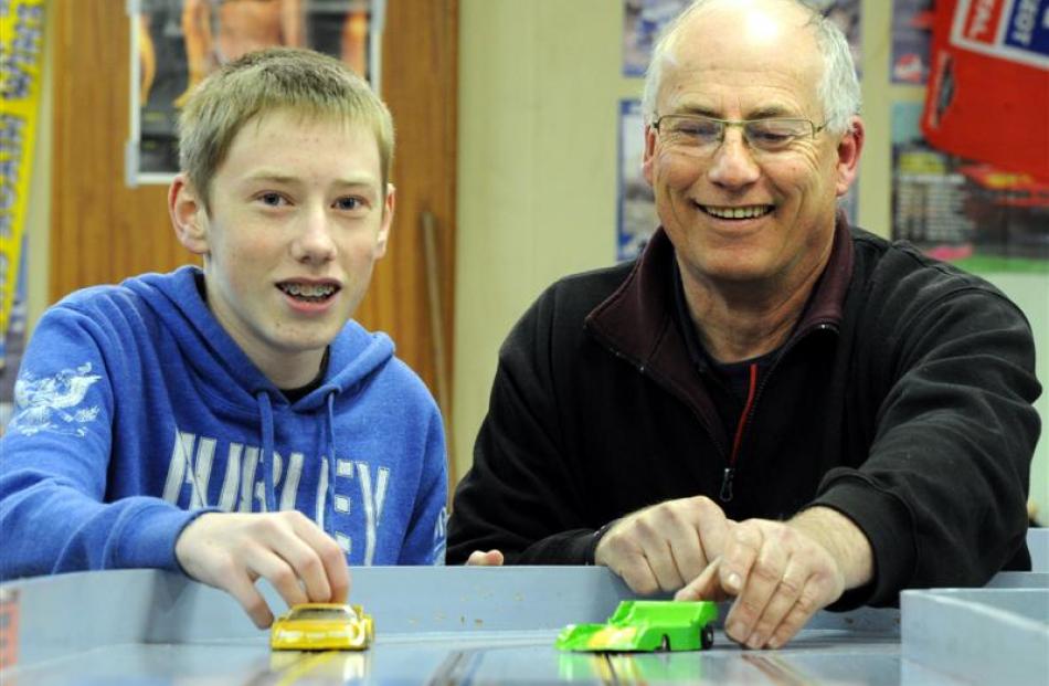 Pitlane Slot Car Club members  Jack Watson (14), of Abbotsford, and Graeme Saxton (58), of...