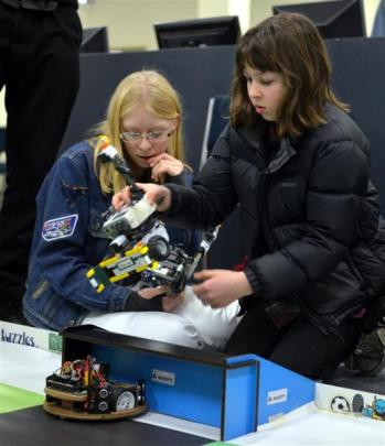 Placing robots on the soccer pitch  Caitlin Shaw (left) and Heather Robertson, both 13, watch...