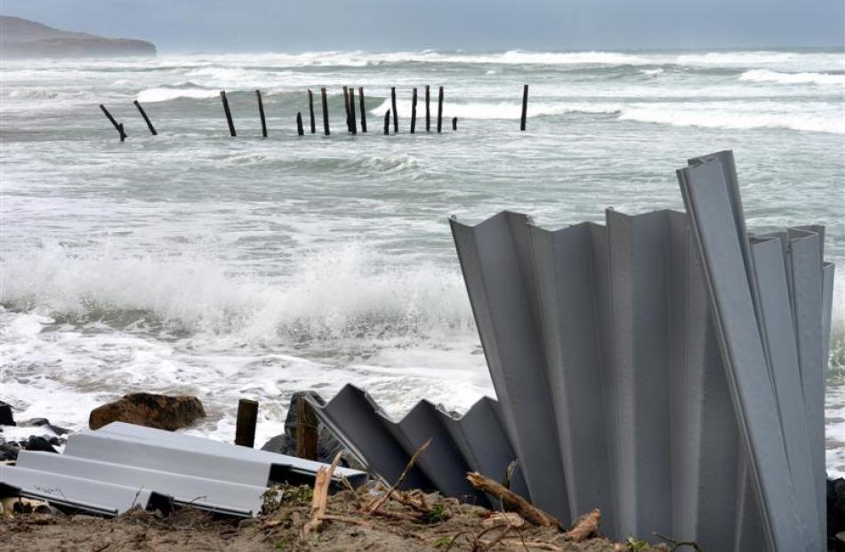 Plastic sheet piling put in place last week has already been bent and broken by the waves at St...