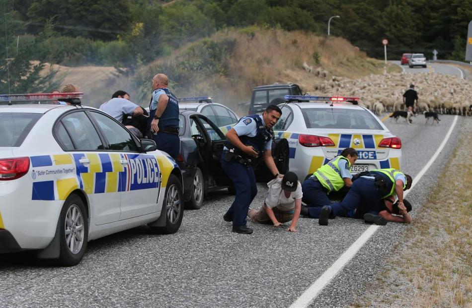 Police arrest four people in Littles Rd, near Arrowtown, about 9.30am yesterday, after pursuing...