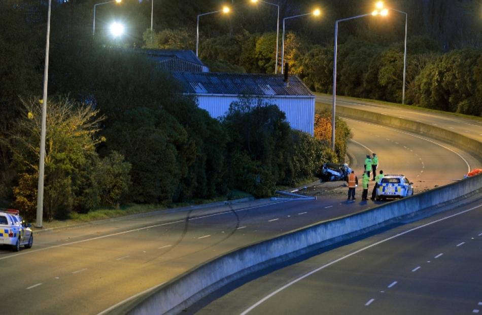 Police at the scene of this morning's fatal crash on Dunedin's Southern Motorway. Photo by...