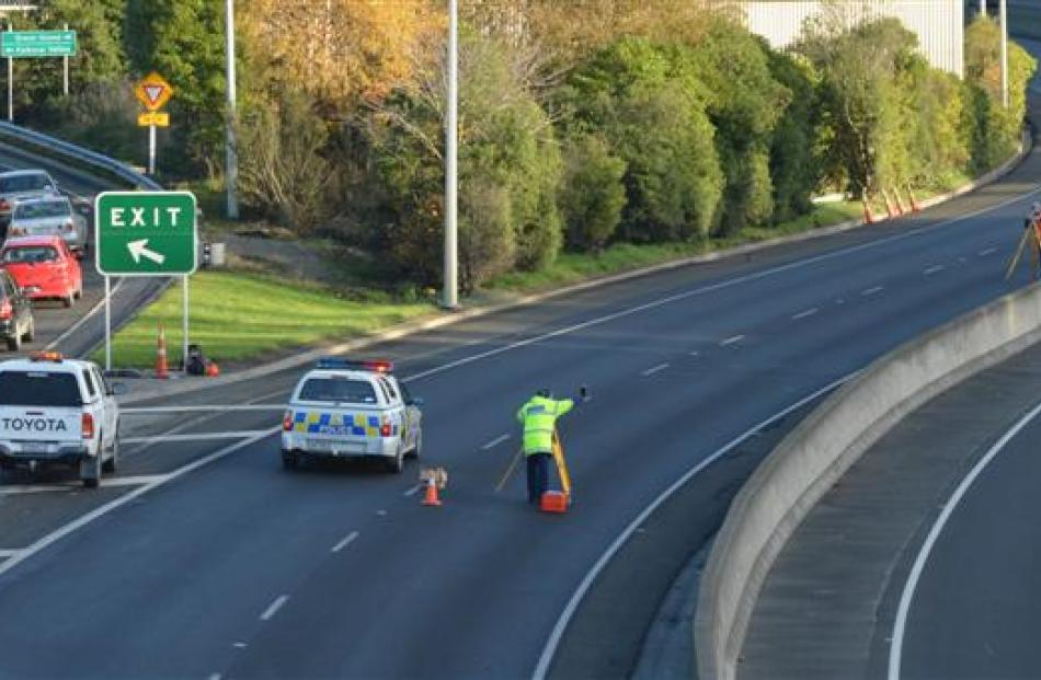 Police from the Serious Crash Unit carry out a scene investigation on the southbound lane of the...