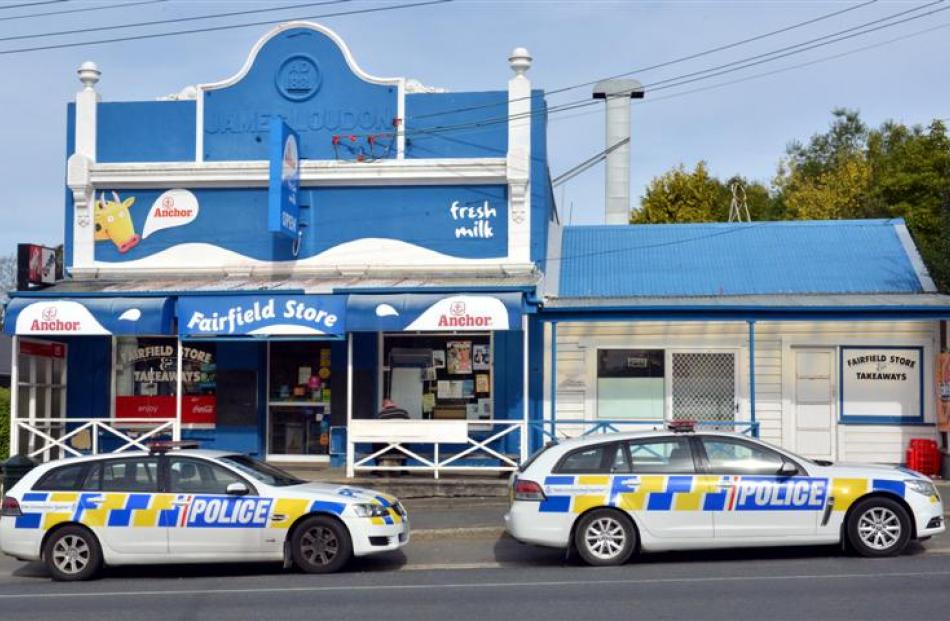 Police outside Fairfield Store and Takeaways in Dunedin yesterday. Photo by Gerard O'Brien.
