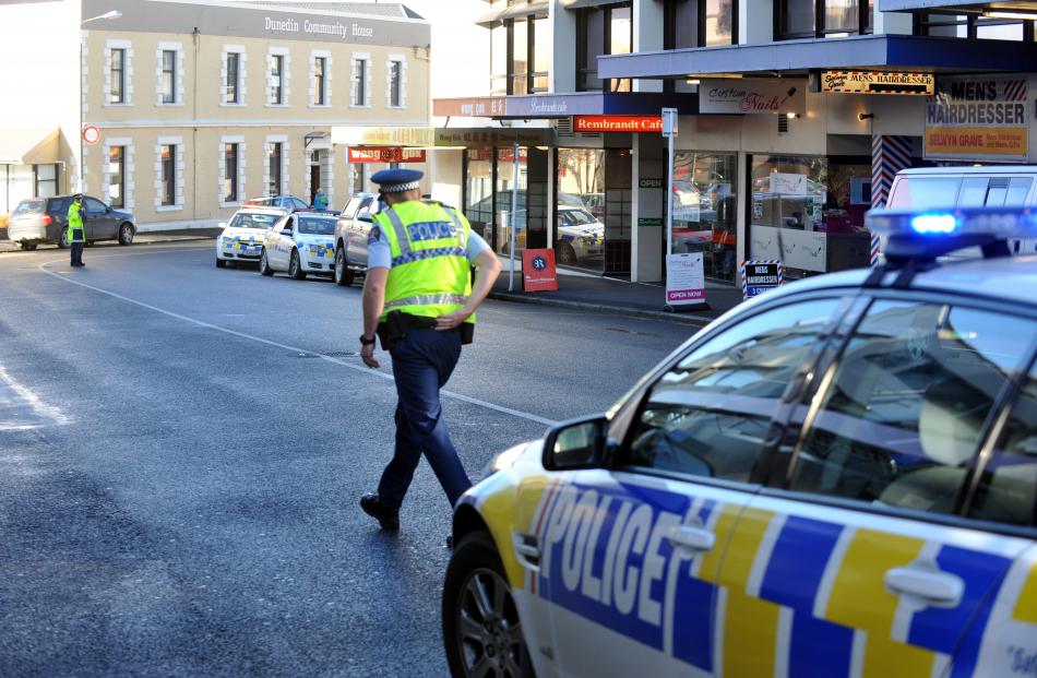 Police secure the scene after a pedestrian was seriously injured in Moray Pl, Dunedin. Photo by...