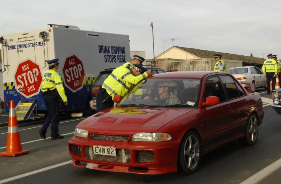 Police stop drivers at a drink-driving checkpoint in Dunedin. Photo by ODT.