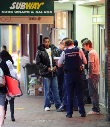 Police talk to witnesses in Princes St yesterday. Photo by Craig Baxter.