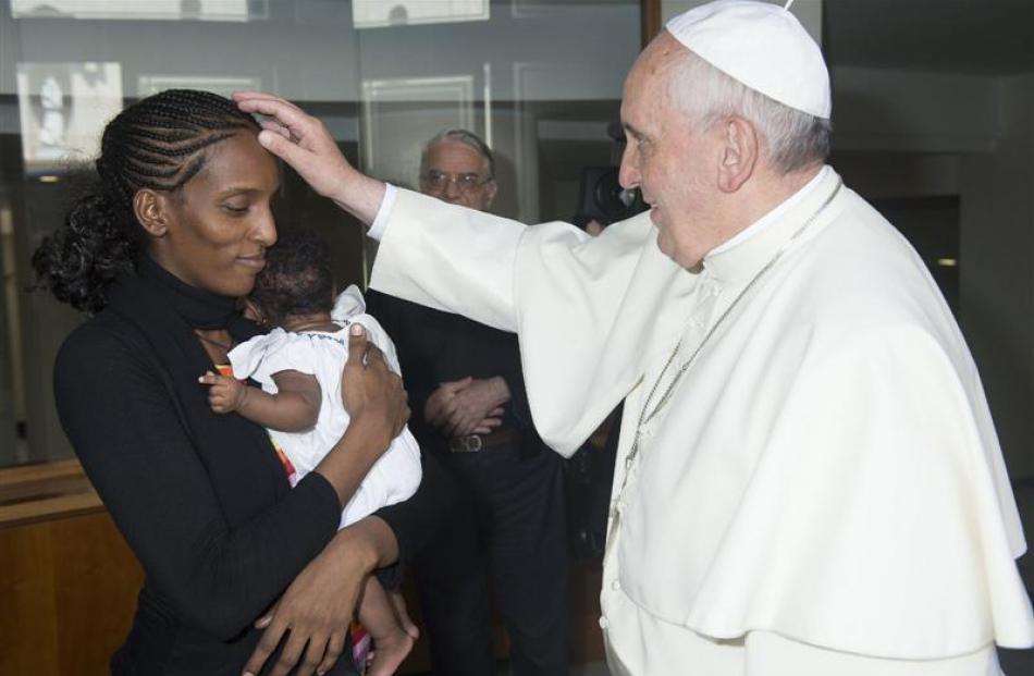 Pope Francis blesses Mariam Yahya Ibrahim of Sudan during a private meeting at the Vatican last...