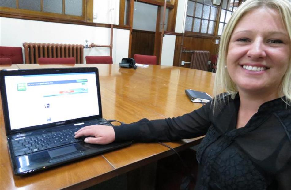 Post A Note Otago community representative Haley McKay promotes the free classified site.  Photo...