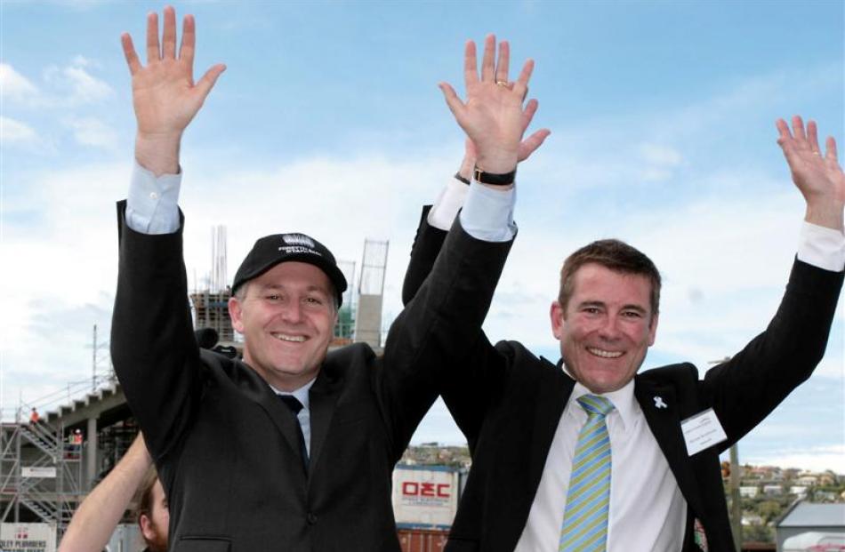 Prime Minister John Key and National MP Michael Woodhouse attempt a mexican wave at the new...