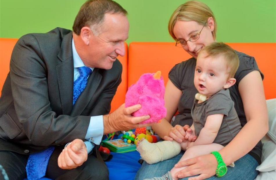 Prime Minister John Key entertains Brendan Forbes, who was in Dunedin Hospital's new paediatric...