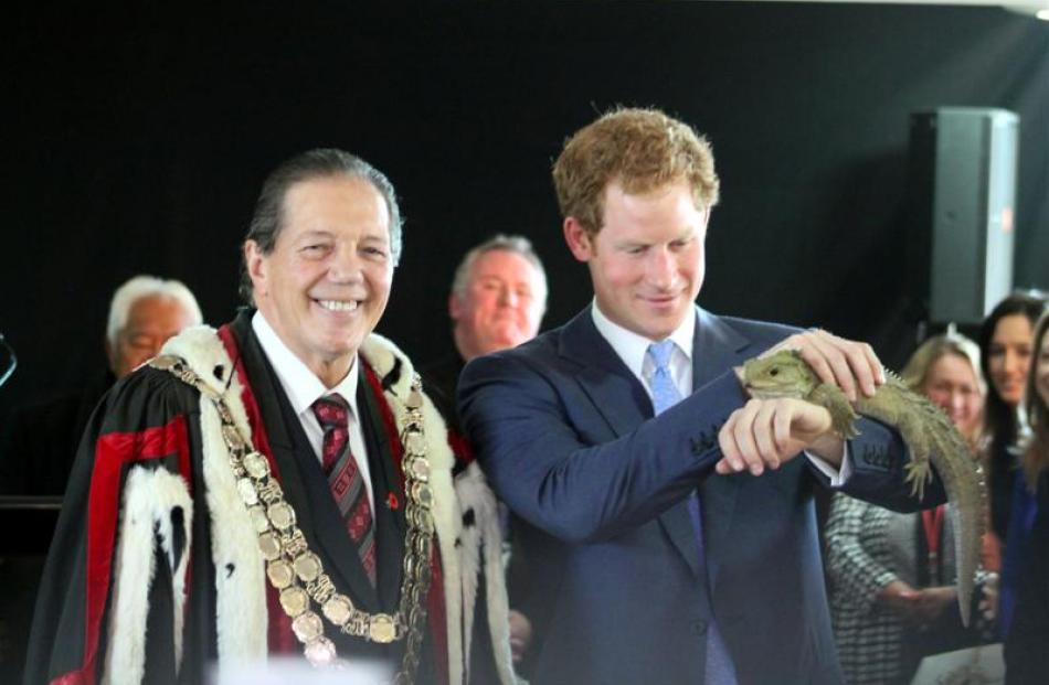 Prince Harry holds Henry the tuatara, from the Southland Museum and Art Gallery. Photo by Allison...