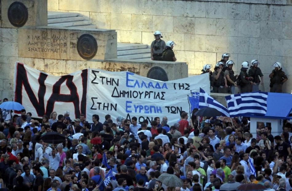 Pro-Euro protestors gather on Constitution (Syntagma) square in front of the parliament building,...