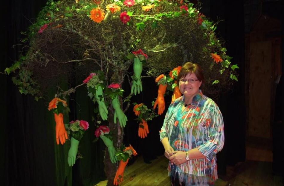 Professional florist and floral art designer Francine Thomas, of Tauranga, with her design "Hands...