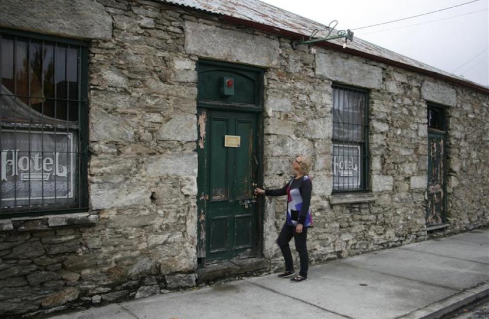 Promote Dunstan committee member Karin Bowen inspects the historic  stone building in Clyde....