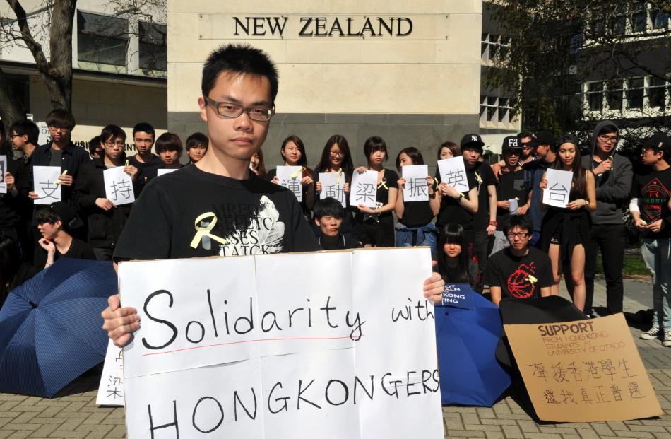 Protest organiser Yuk Hin Shiu and Otago University students show solidarity with the pro...