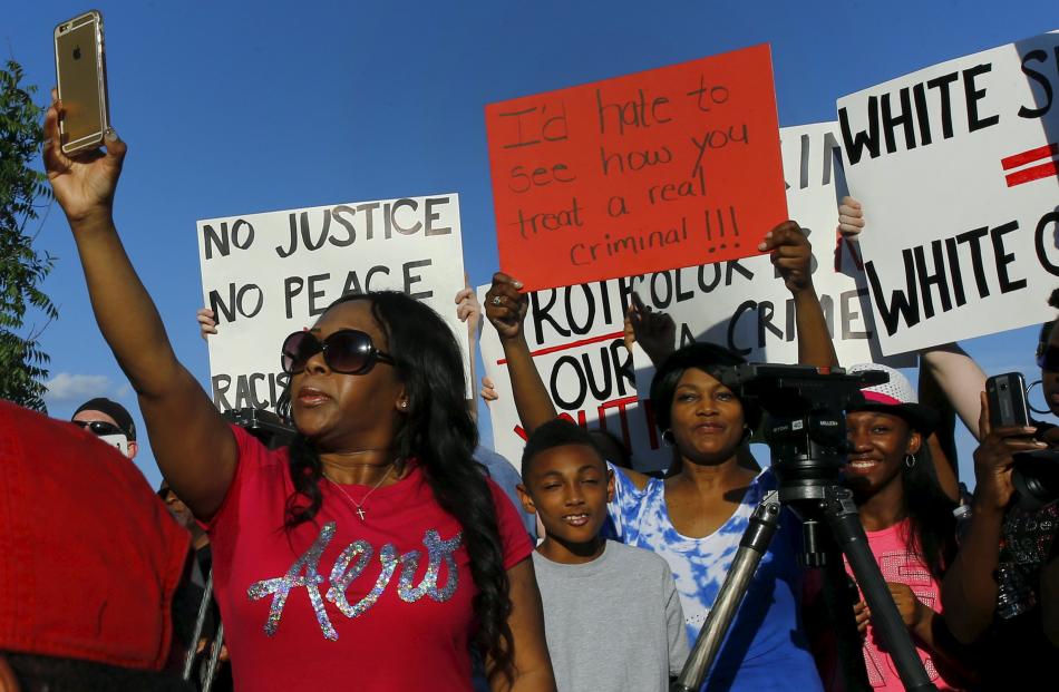 Protesters at the peaceful rally in McKinney want police to be more accountable. Photo: Reuters