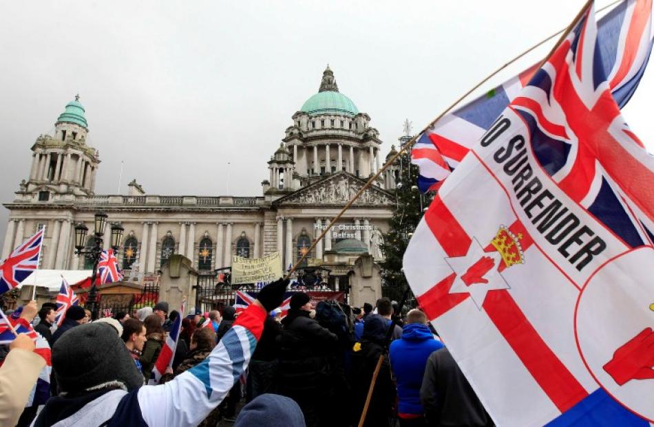 Protesters rally in front of Belfast's City Hall demanding the British flag be returned to the...