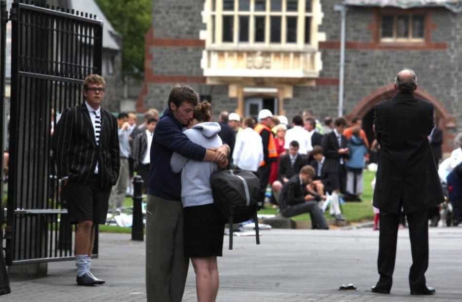 Pupils at Christs College comfort each other. Photo: NZPA / Ashburton Guardian, Kirsty Graham