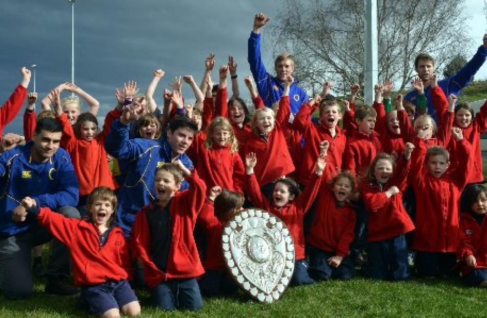 Pupils from Omakau School celebrate with the shield this week.