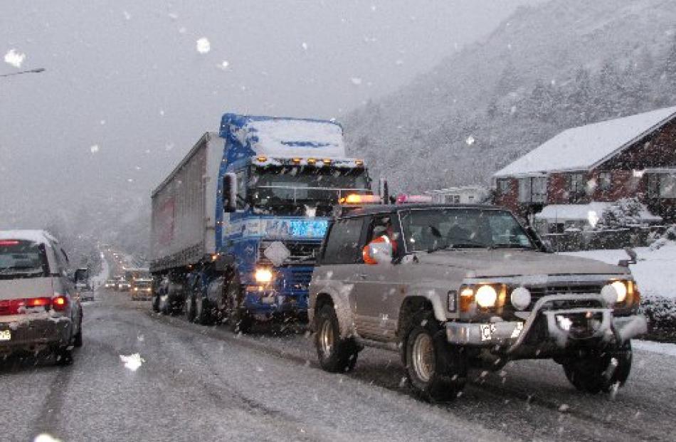 This freight truck was towed up the Frankton Rd incline, near the Kawarau Rd roundabout, this...