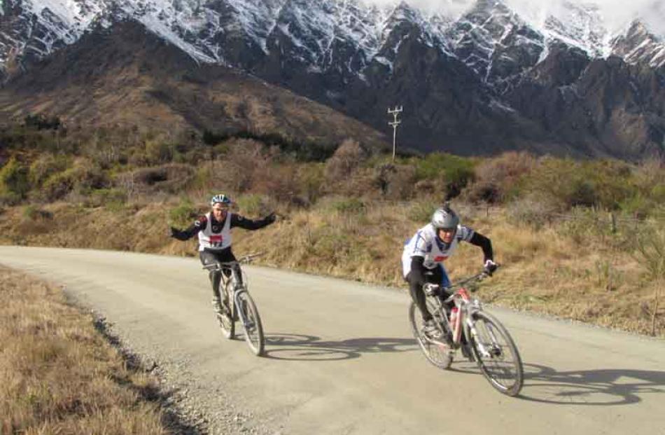 Dave Drake, of Luggate, (left) of the team Cardies Crew, has no problems cycling down the...