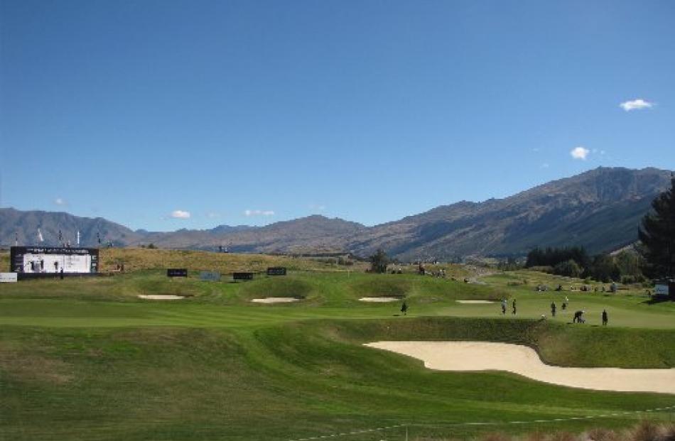 Golfers make their way to the 18th hole of The Hills during the first day of the 2012 NZPGA Pro...