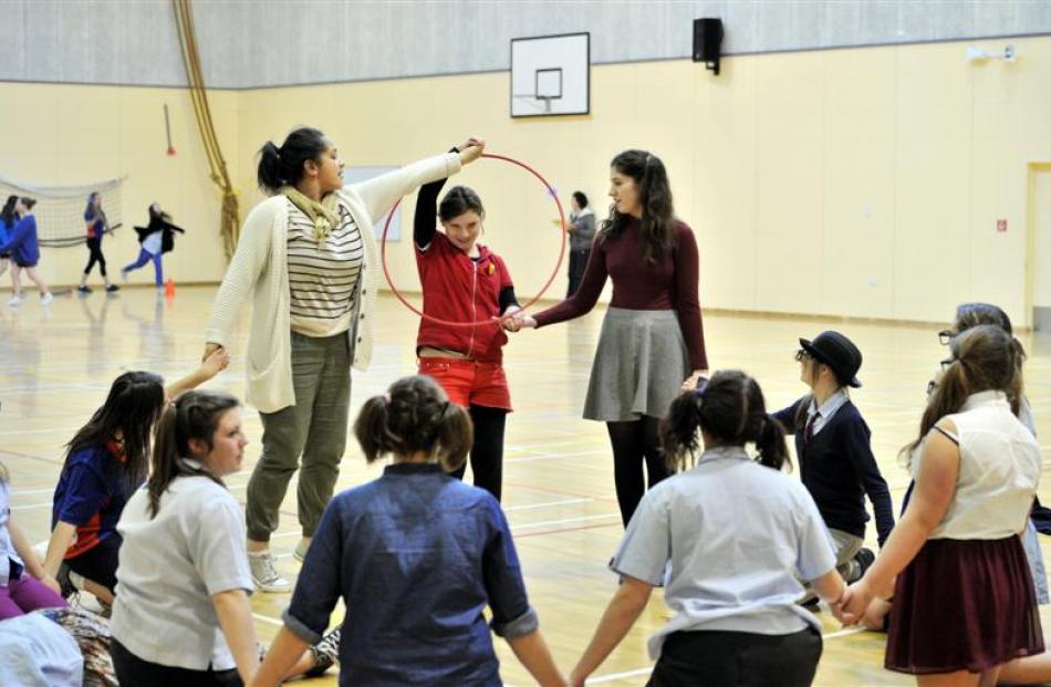 Queen's pupils (facing the camera from left) Savannah Ngatae (18), Meredith Chittock (13) and...