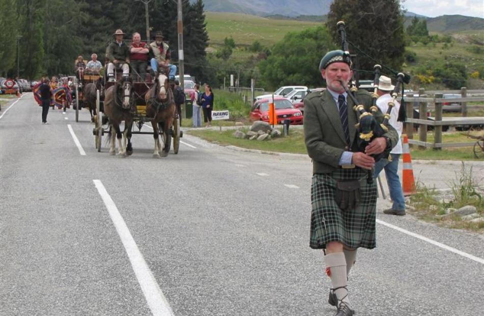 Queenstown bagpiper Graeme Glass (above)  leads the procession through the main street of Cardrona.