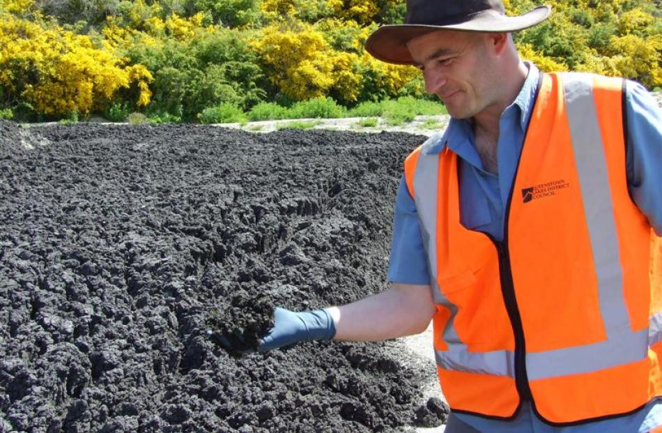 Queenstown Lakes District Council strategic project manager Martin O'Malley  checks drying sludge...