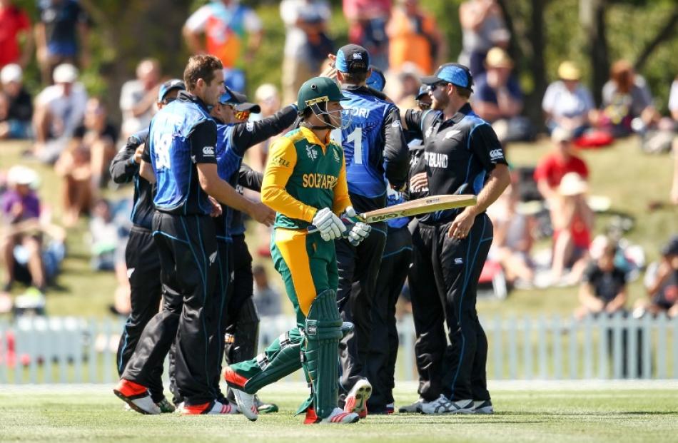 Quinton de Kock of South Africa leaves the field after being dismissed during the ICC Cricket...