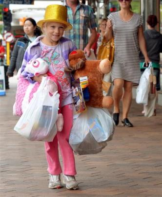 Rebekah Davies (6), of Dunedin, joins the tide of shoppers in George St. Photos by Stephen...