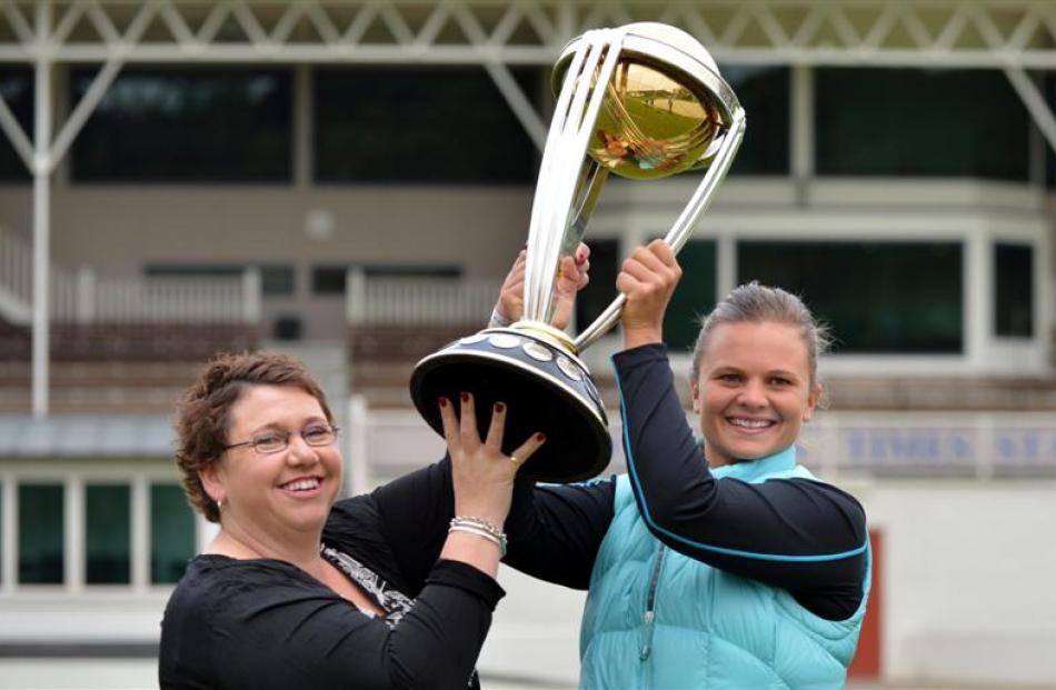 Regional volunteer co-ordinator Vicki Kestila and White Ferns captain Suzie Bates hold the ICC...