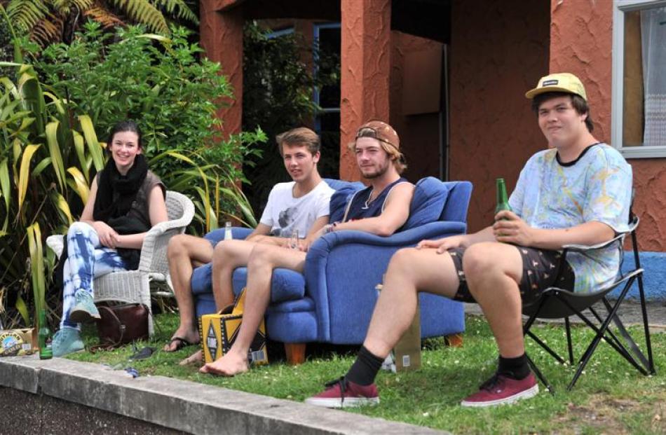 Relaxing outside their flat ''Barcelona'' in Cumberland St are (from left) Olivia Price (19), of...