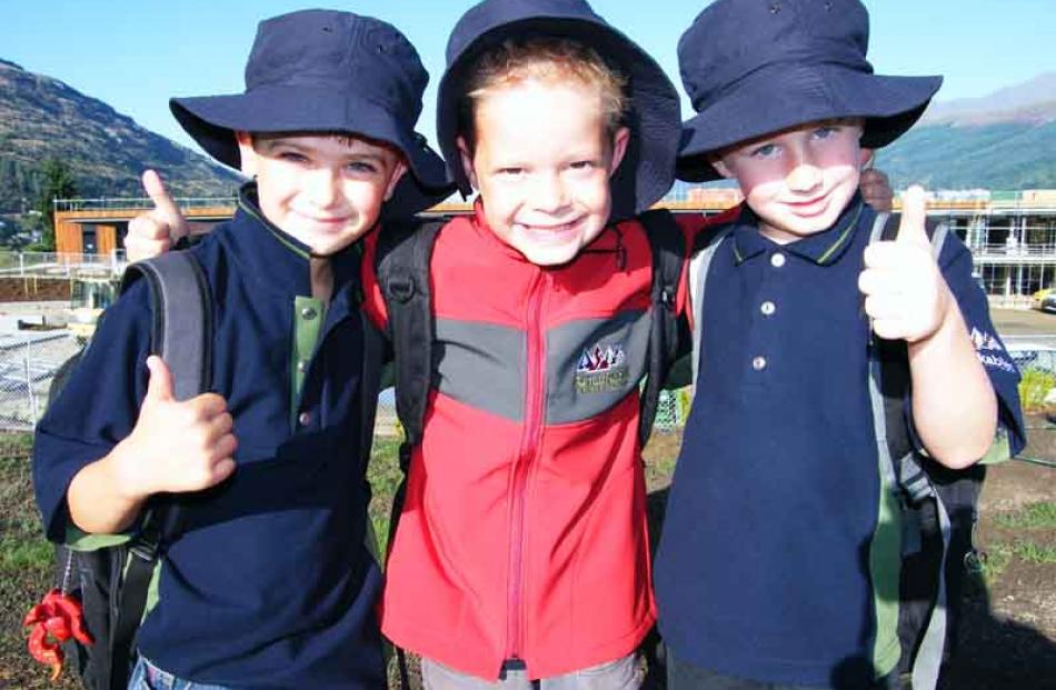 Day-one pupils (from left) Angus Thompson (6), Ethan Moss (6) and Johannes Mackay (6), all of...
