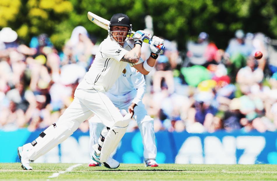 rendon McCullum of New Zealand drives the ball away for four runs during the test match between...