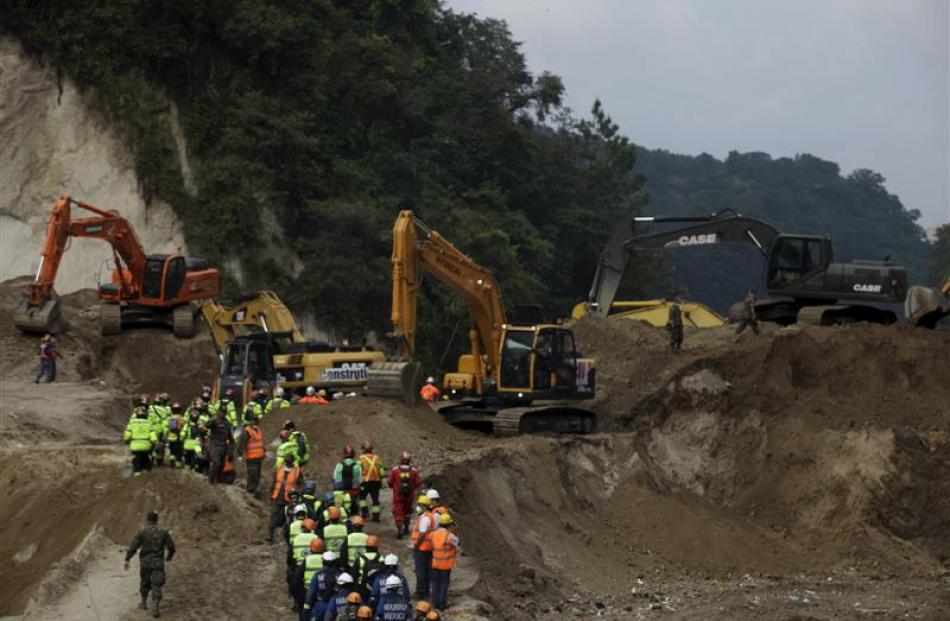 Rescue workers arrive at an area affected by the mudslide in Guatemala. Photo: Reuters