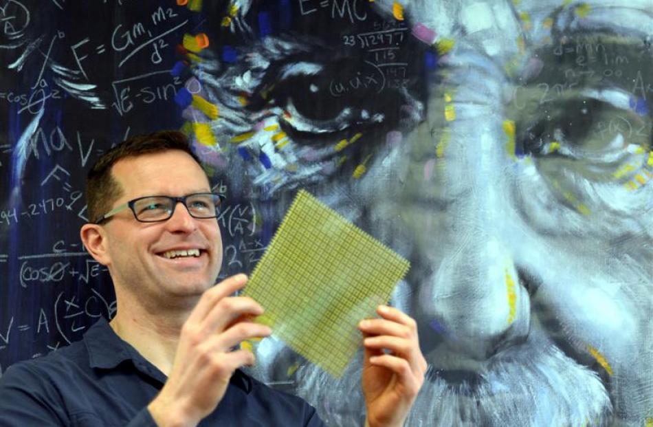 Research fellow Dr Robert Thompson with an example of the sort of meta-material used in cloaking...
