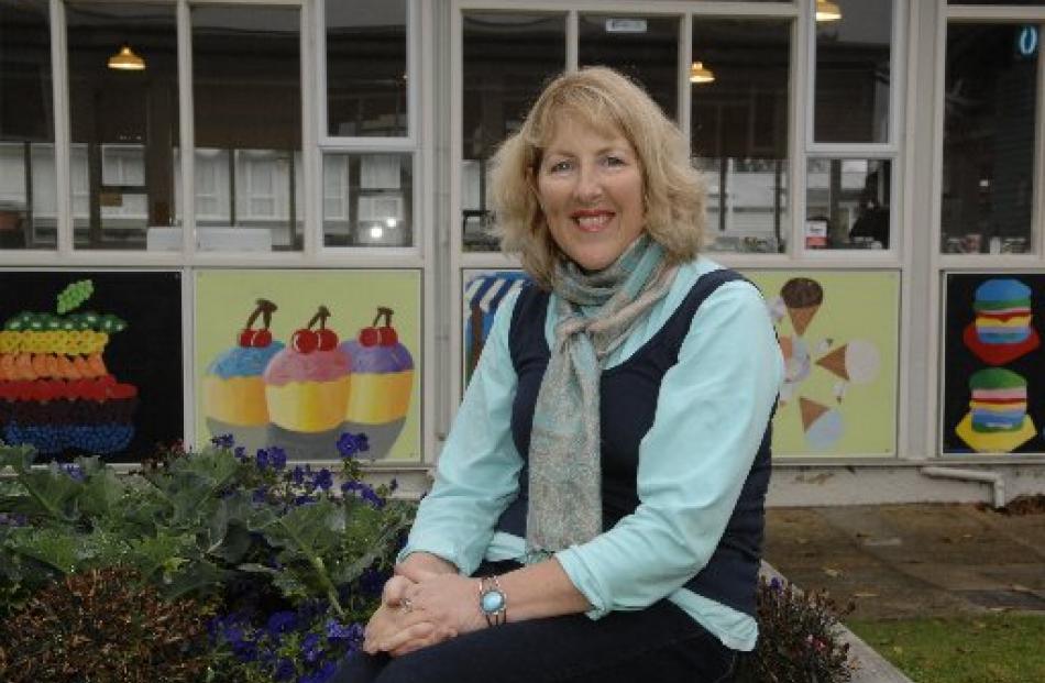 Retired Balmacewen Intermediate teacher Ann Venables next to the school's vegetable patch and...