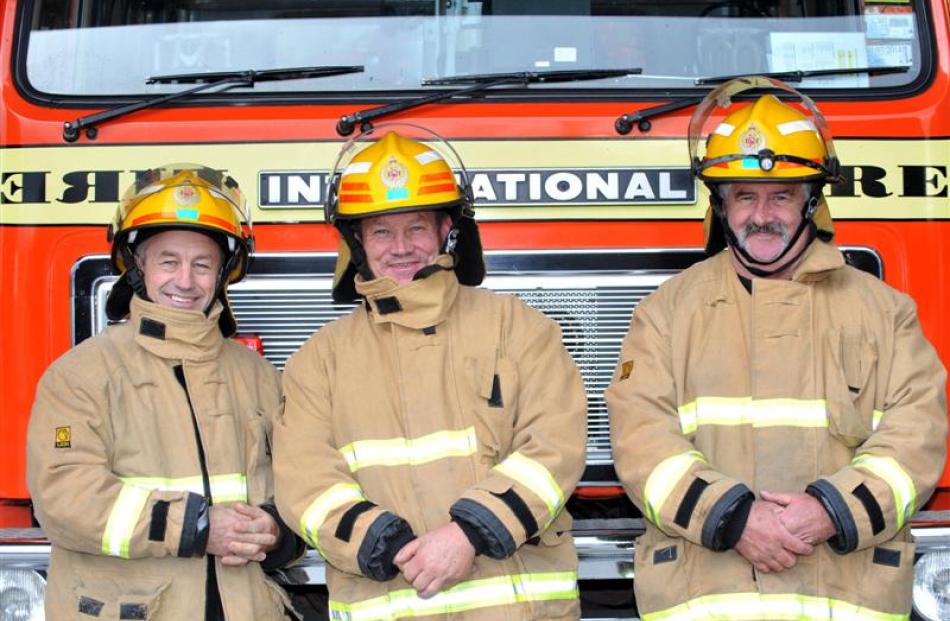 Retiring firefighters (from left) Mike Meiklejohn (56), Merv Treloar (53) and Stan Prattley (56)....