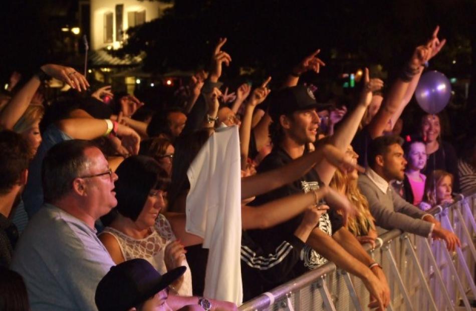 Revellers enjoy live music on the Earnslaw Park stage. Photos: Guy Williams