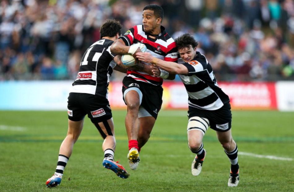 Rey Lee-Lo of Counties Manukau is tackled by Richard Buckman (R) and Zac Guildford of Hawkes Bay...