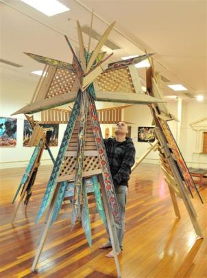 Riverton artist Chris Flavell with his Maori kite sculptures at the Dunedin Community Gallery....