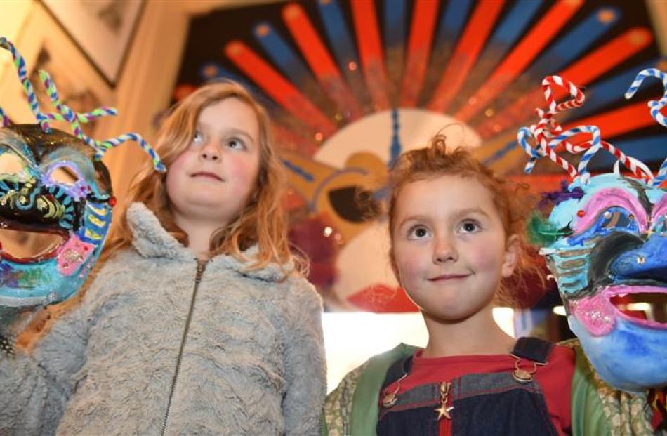 Romahapa sisters Cassie (7, left) and Joss (6)  Winslade  show off their masks at last night's...