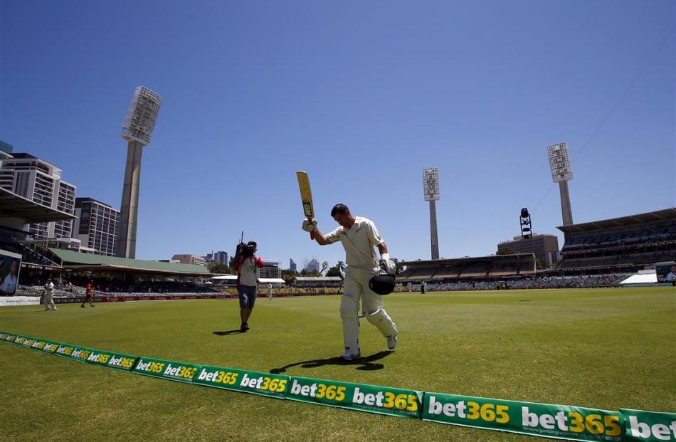 Ross Taylor acknowledges the crowd as he walks off the ground in Perth after being dismissed for...