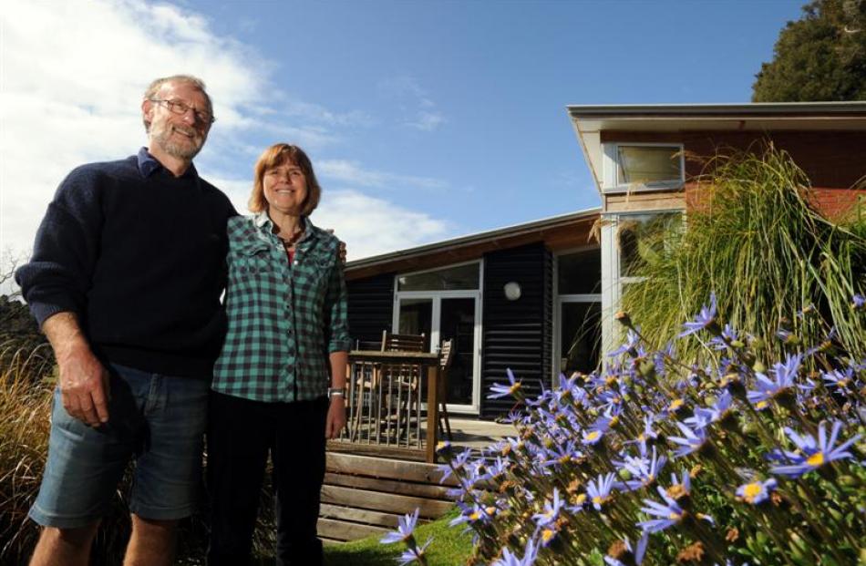 Roy and Jan Johnstone in their terraced garden. Photo by Peter McIntosh.