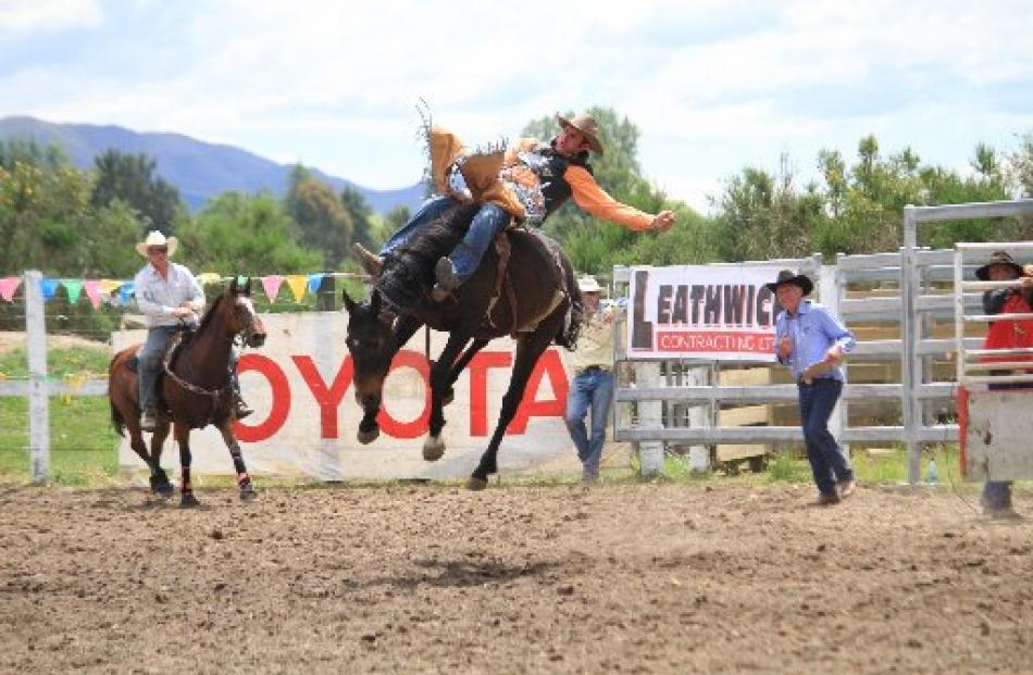 Scott Graham competes in the open bareback at the Waimate Rodeo Club's 60th annual rodeo in...