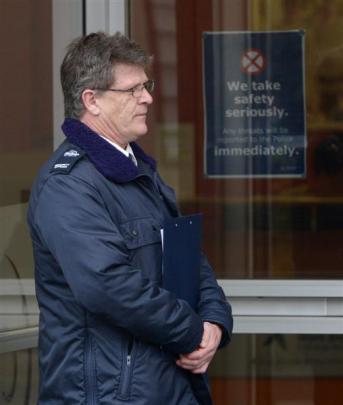 Security staff  stand outside outside Work and Income offices in Rankeilor St yeaterday. Photos...